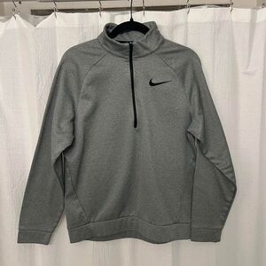 Gray Dri-Fit Nike quarter zip with embroidered swoosh
